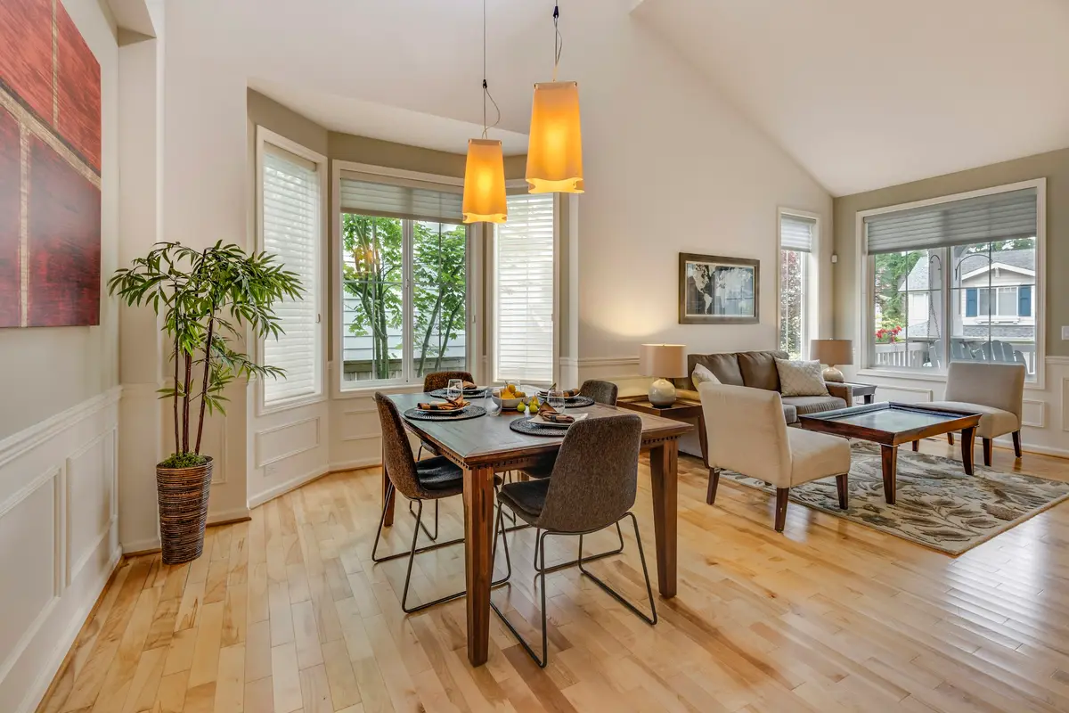 A dining table set in a bay window
