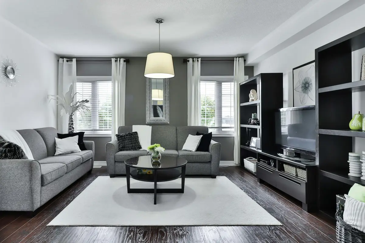 A formal living room in soft greys